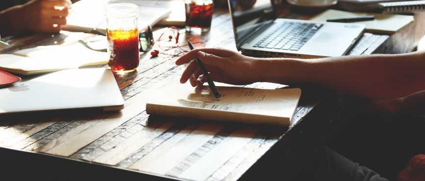 people using table for a meeting