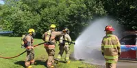firefighters putting out a grass fire