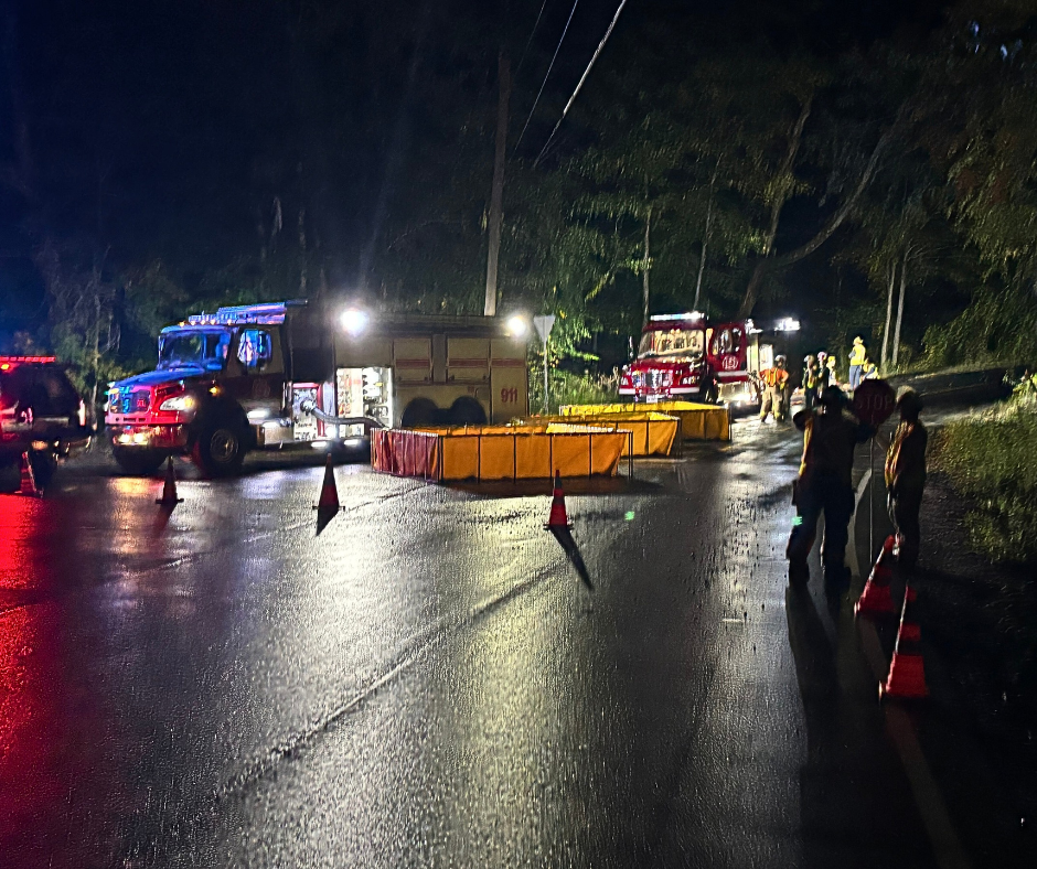 Setting is at night with multiple firetrucks and emergency personnel