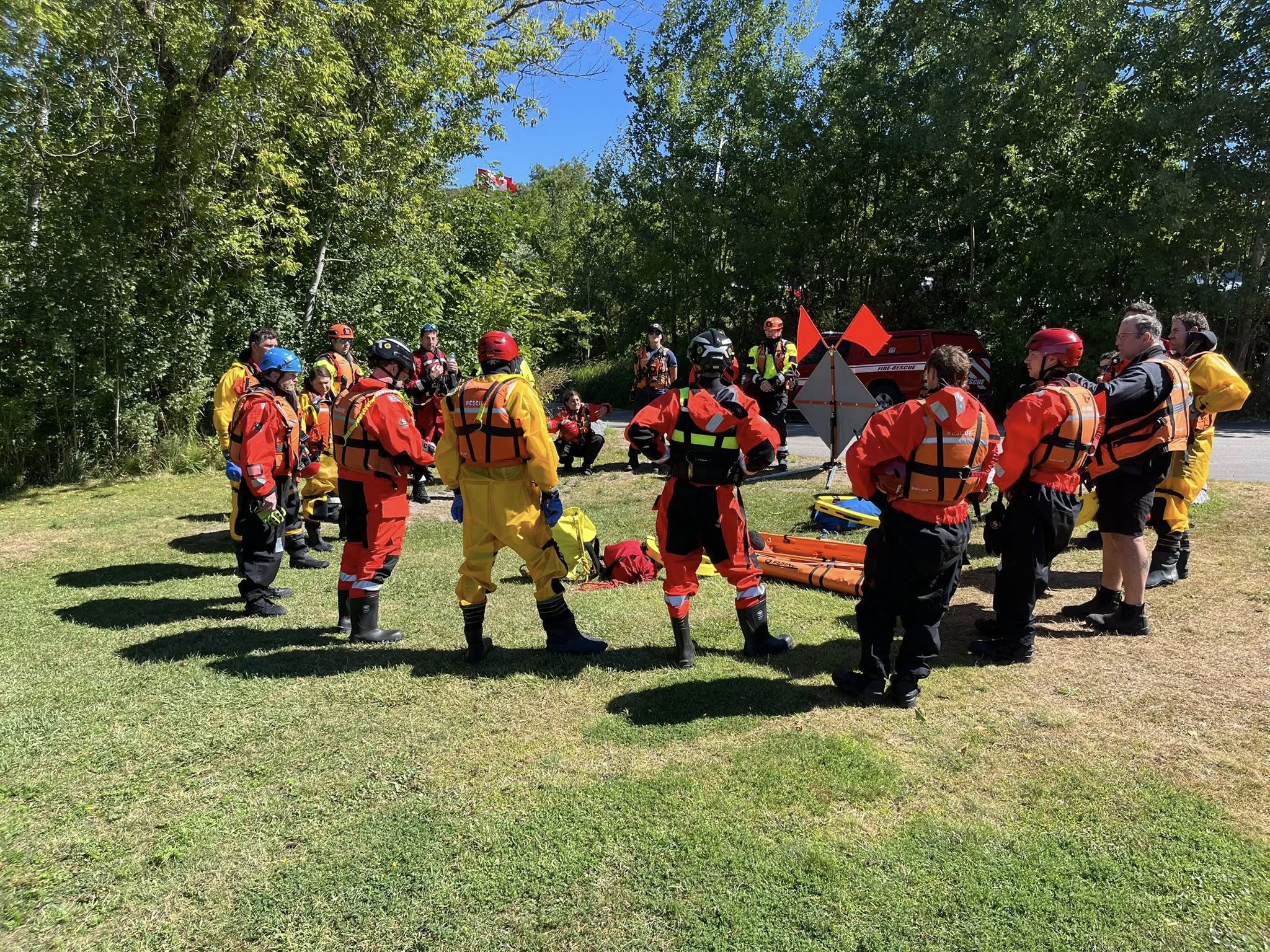 Rescue training personnel standing in a circle