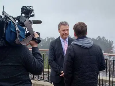 Mayor Phil Harding making  a statement to the media at a Township trail