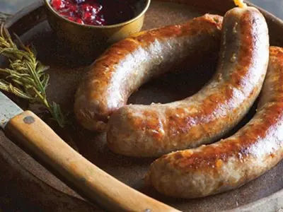 Cooked sausages as part of a hearty meal