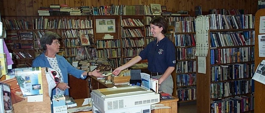 inside of old port carling library with librarian betty glan and borrower