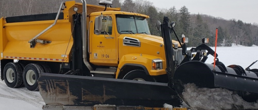 A snowplow plowing snow