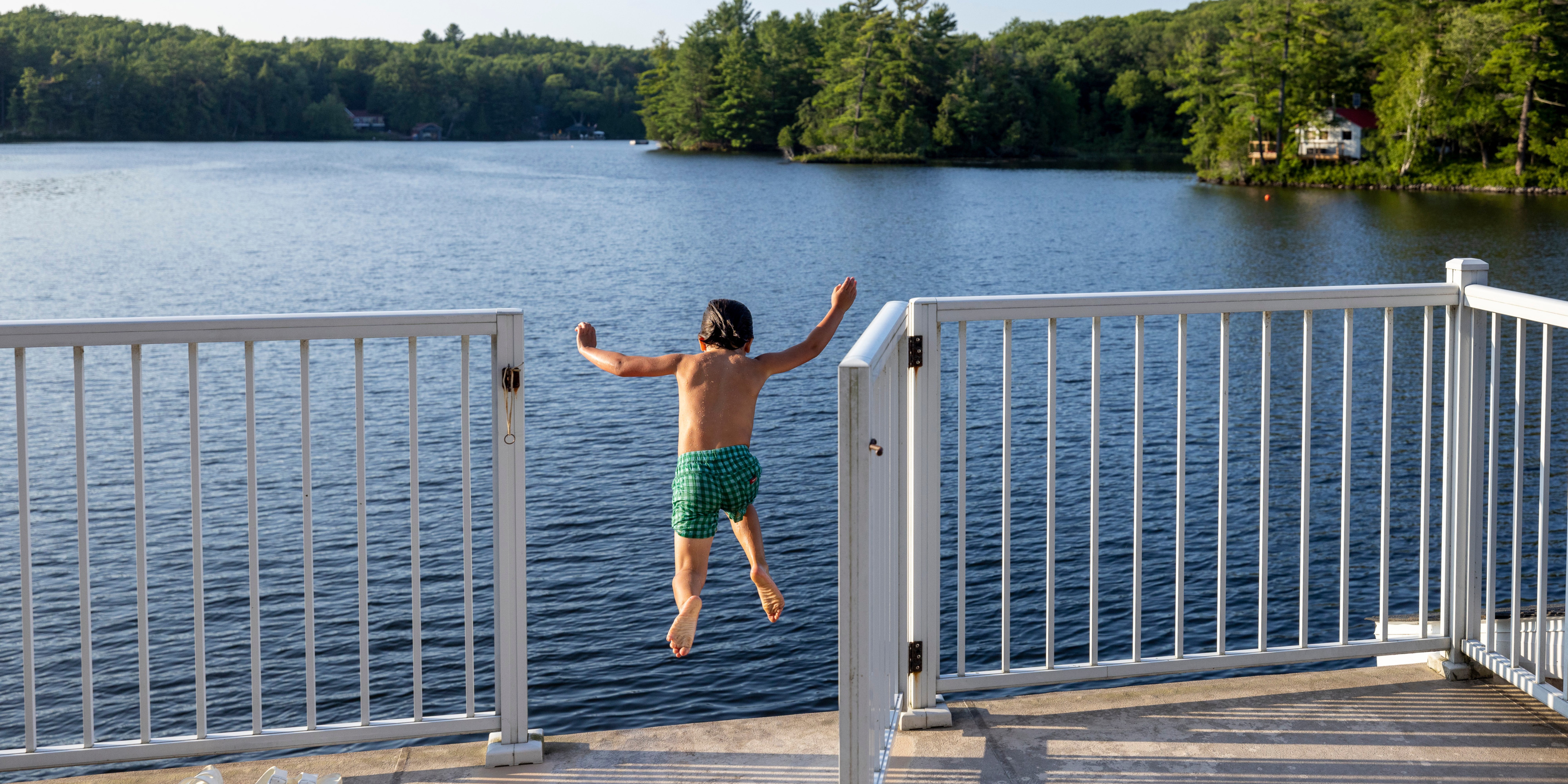 Kid jumping off dock