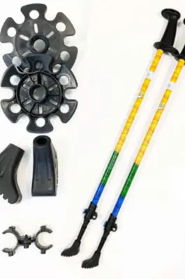 Two walking poles with accessories around them.