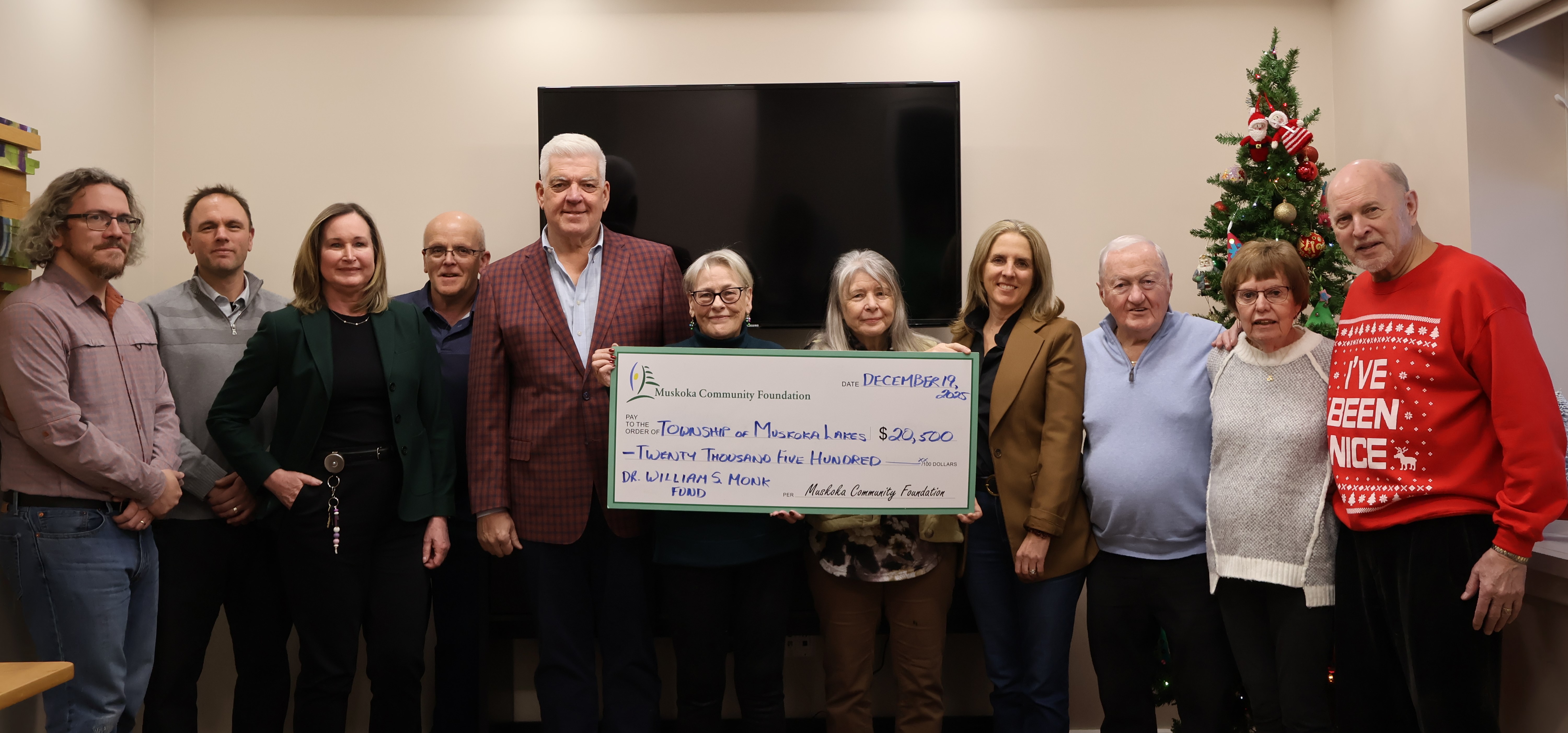Group photo with donation cheque