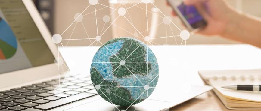 Internet Connectivity - a model of the earth with lines all over and around it