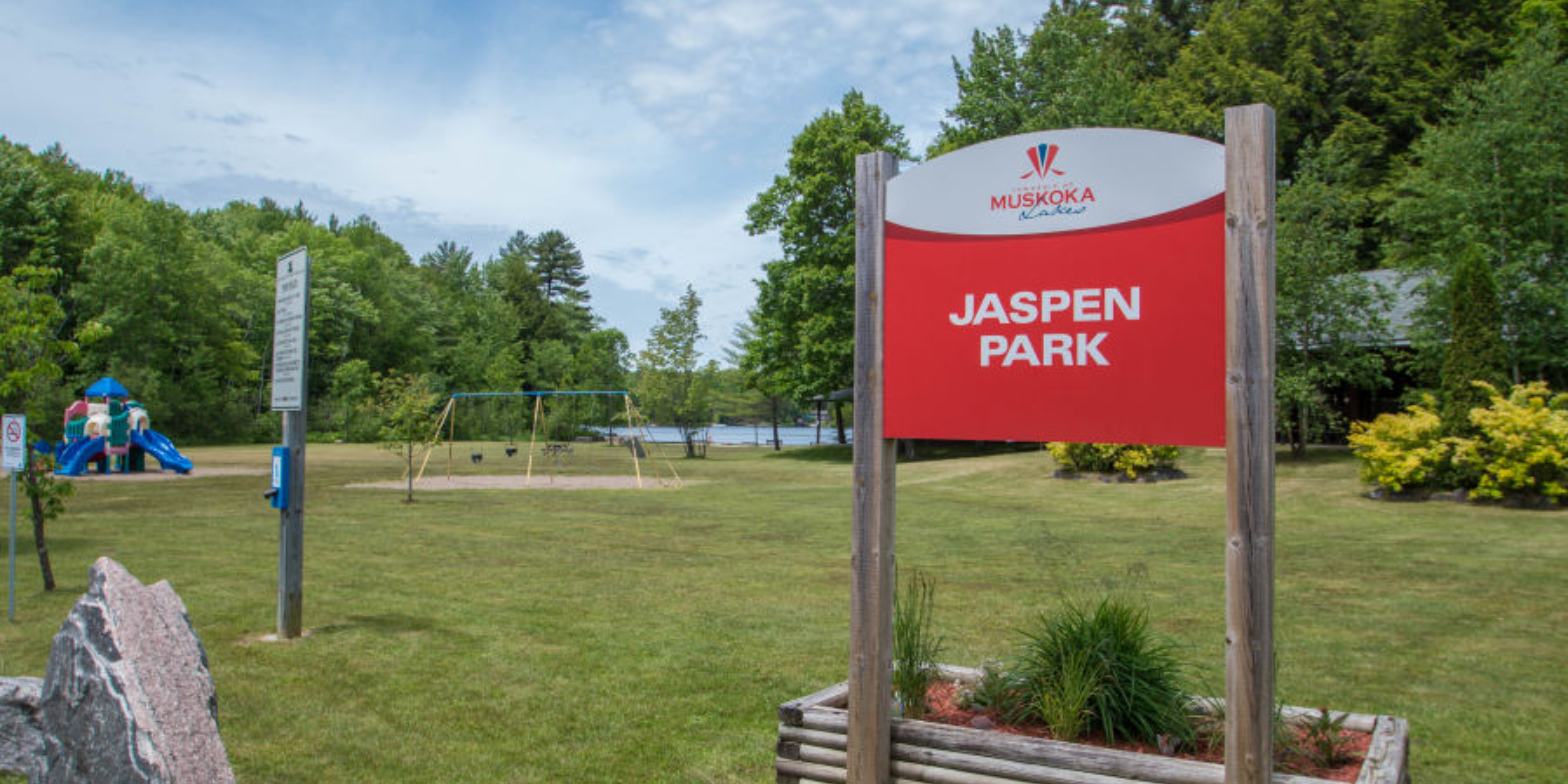 Jaspen Park sign with park in background