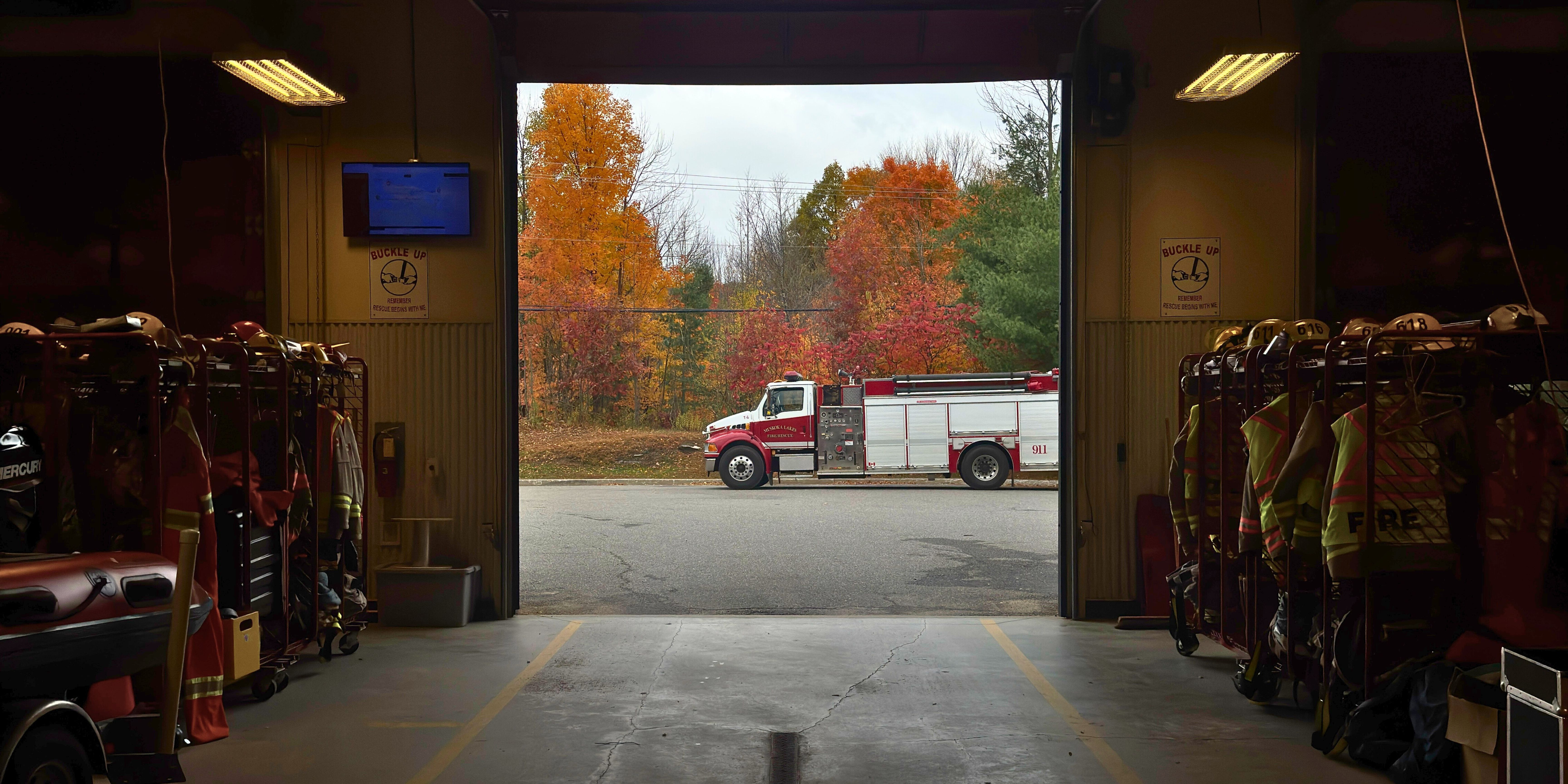 Looking out of a fire hall doorway with a fire truck outside