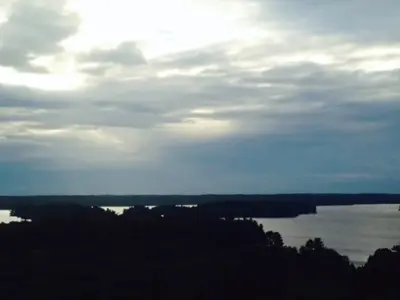 Trees, Lakes And Clouds at sunset