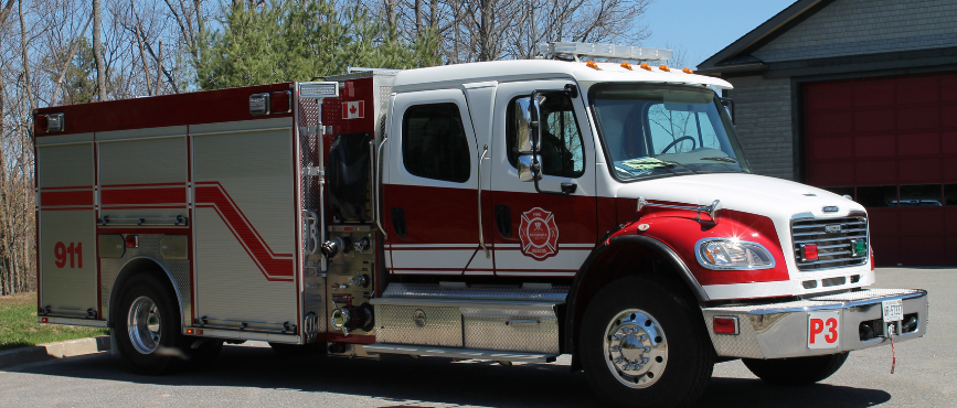 Fire truck in front of a fire station