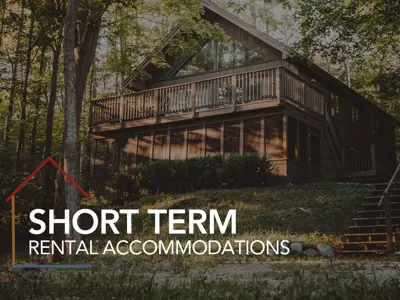 Short Term Rental Accommodations log overlay on a photo of a cottage